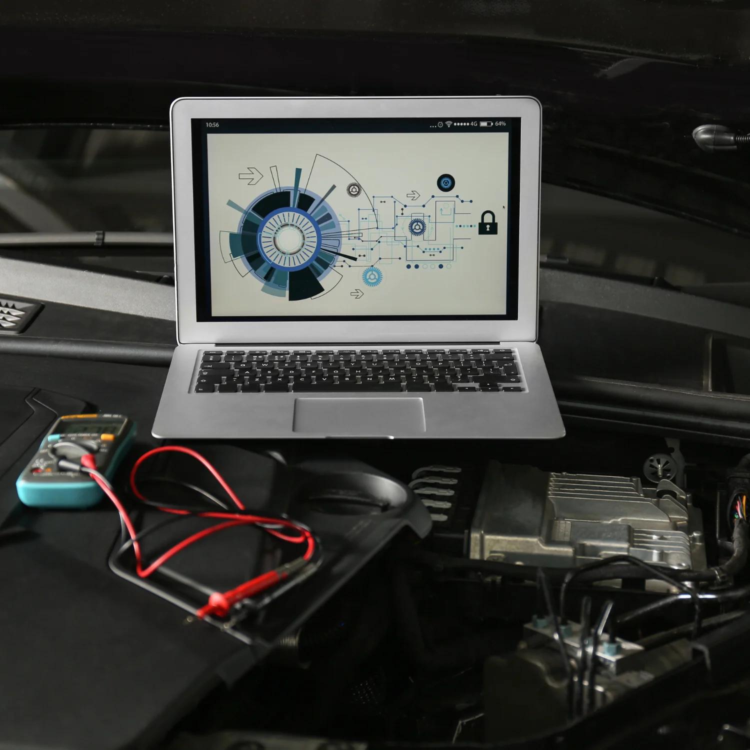 laptop computer on car engine