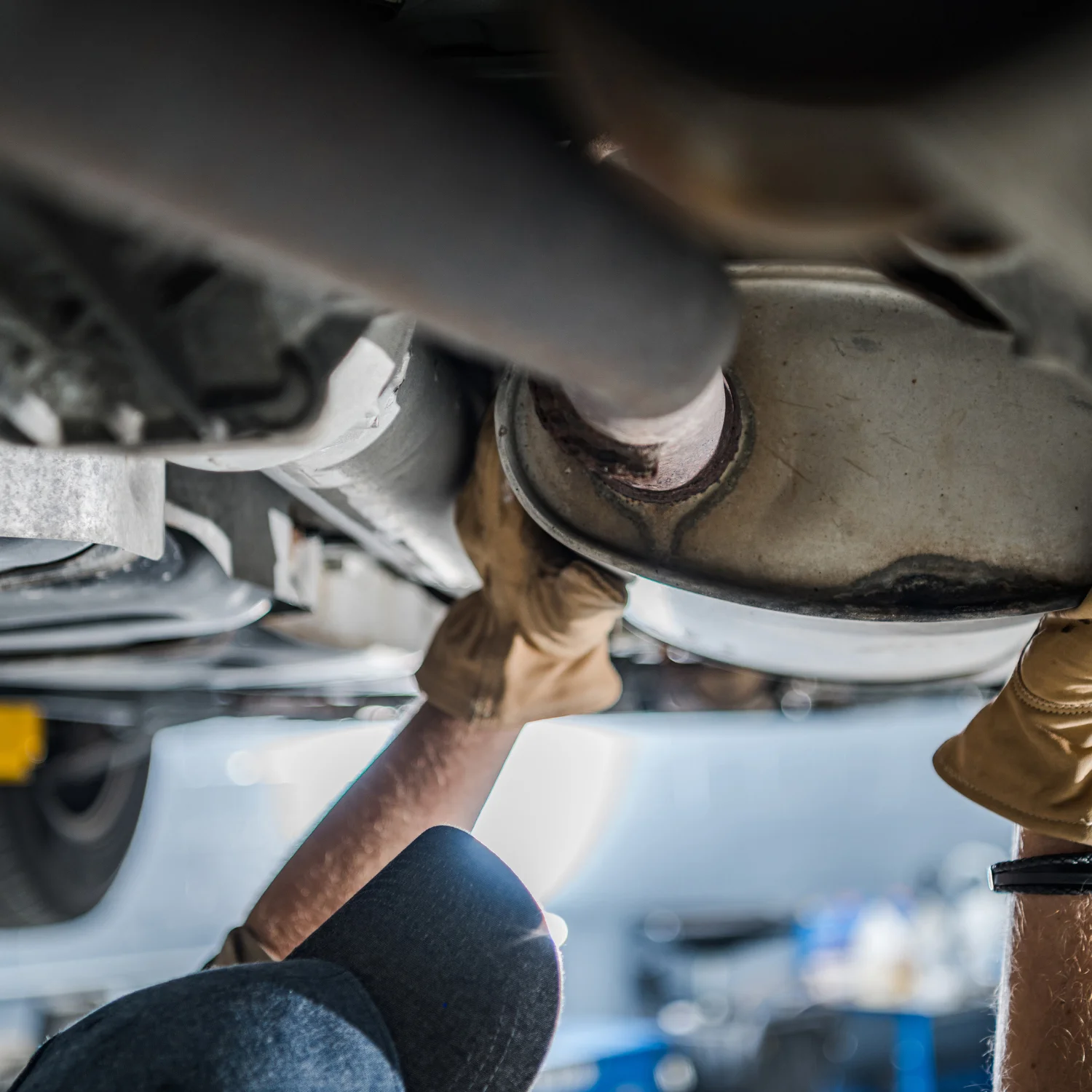 a hand holding the exhaust